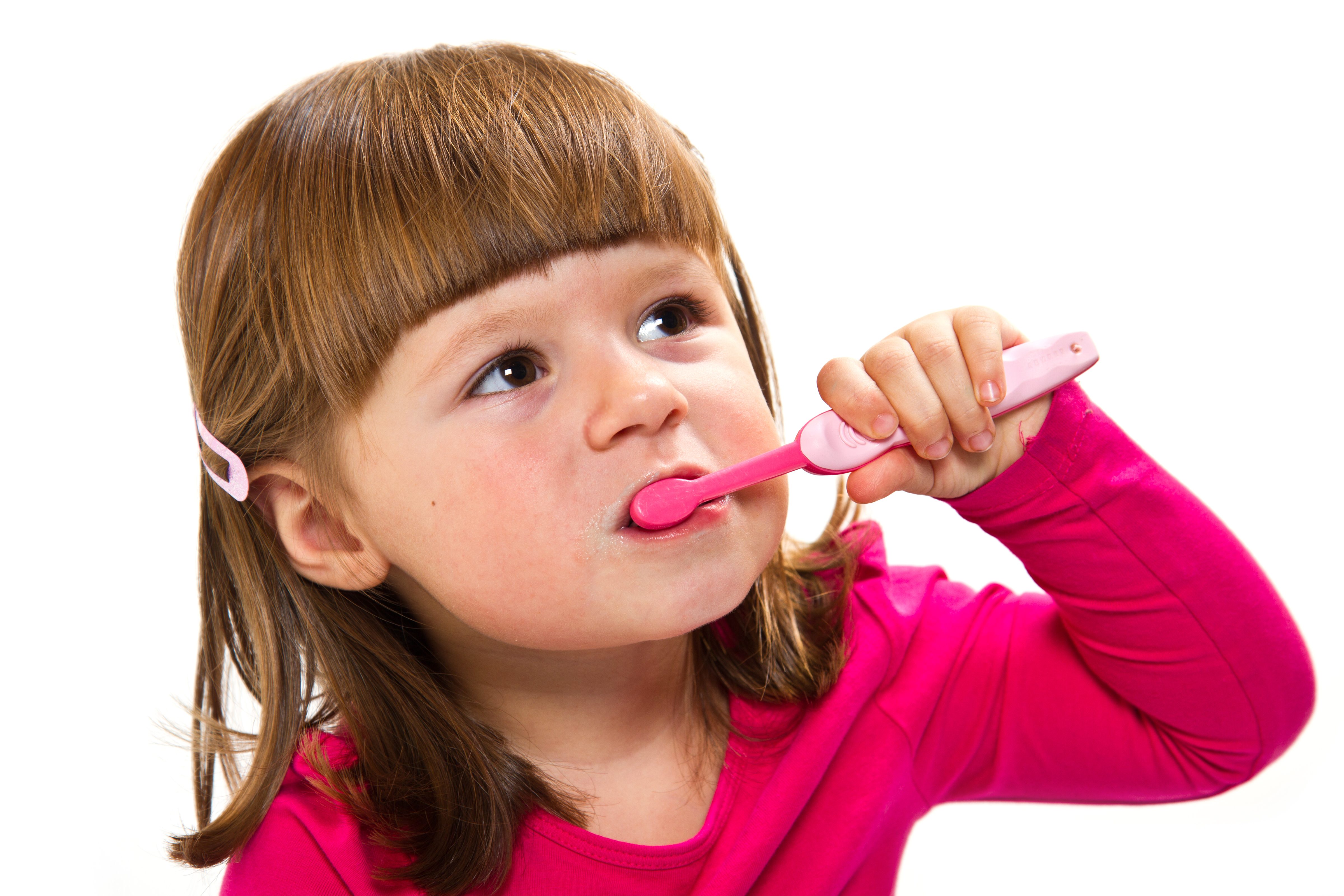 Young girl brushing her teeth